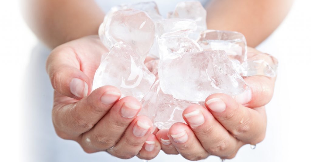 Person holding ice cubes trying to use for DIY CoolSculpting